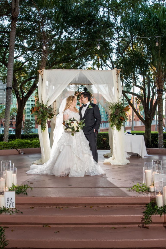 Wedding Couple After Ceremony at Crescent Terrace at the Walt Disney World Swan Resort