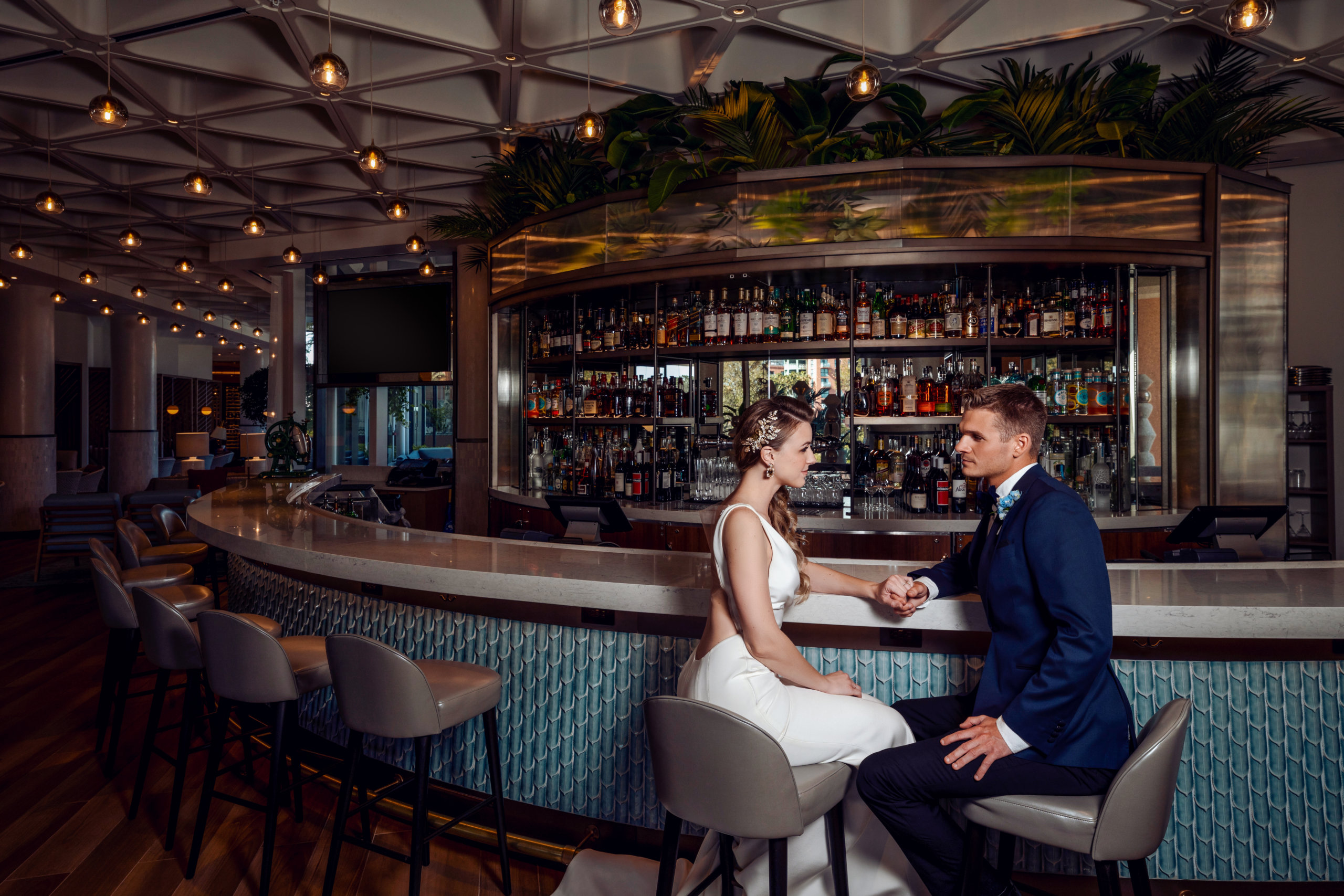 Wedding Couple Sitting at Stir Lounge at the Walt Disney World Swan Reserve