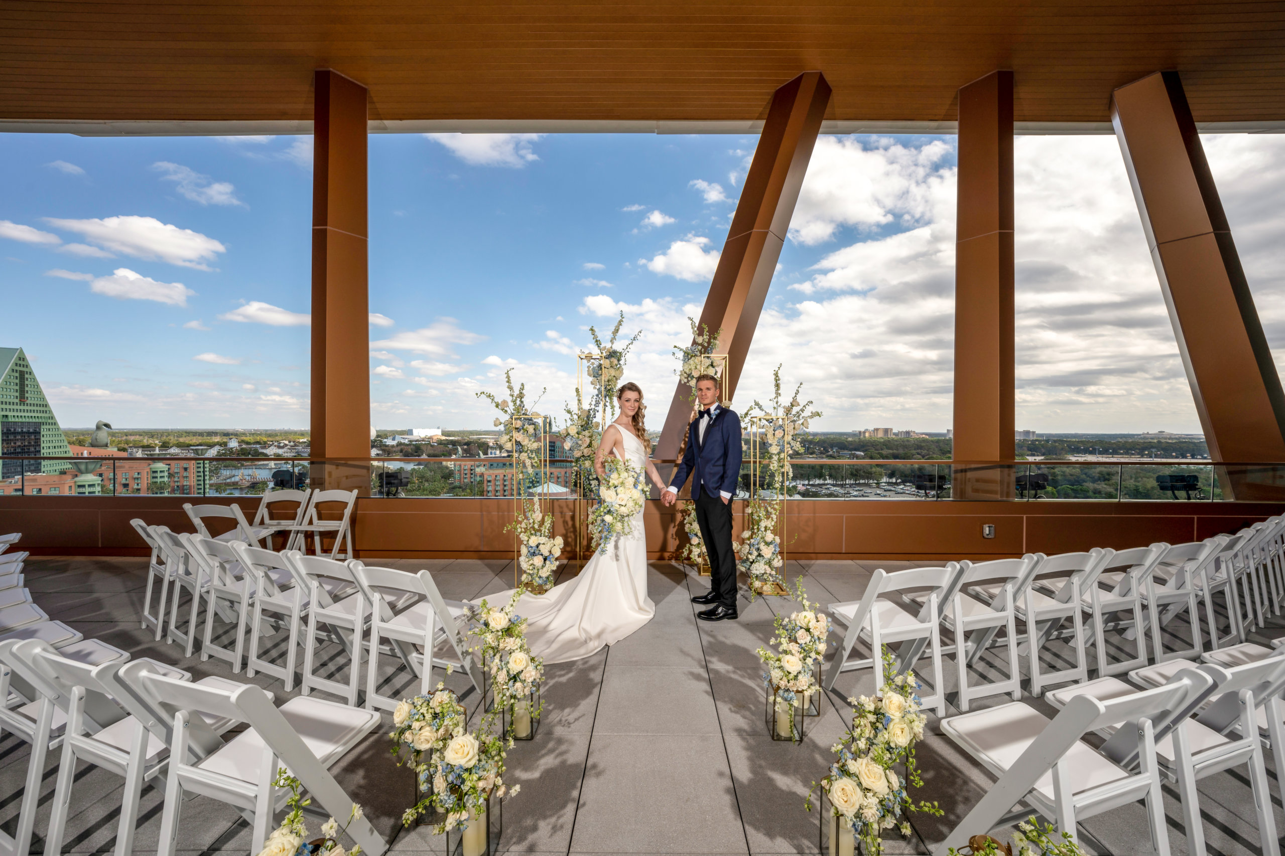 Wedding Couple with Ceremony Set-Up at the Vue Terrace on the Rooftop of the Walt Disney World Swan Reserve
