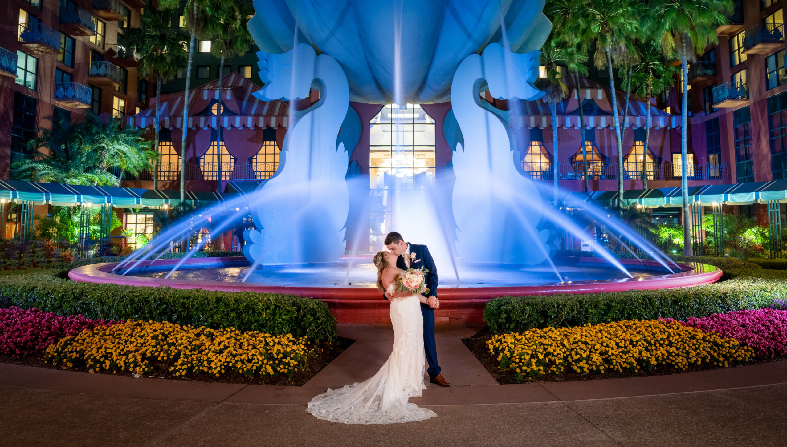 Wedding Couple in Front of Illuminated Fountain at the Walt Disney World Dolphin Resort